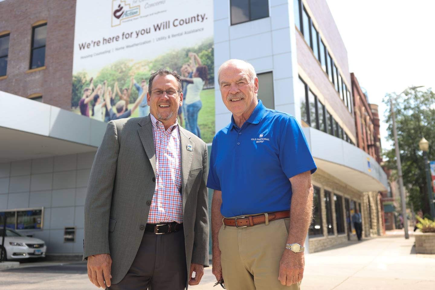 Bob Diedrich, left, and Jim Roolf pose outside the Old National Bank on Chicago Street in downtown Joliet on Tuesday, August 1.
