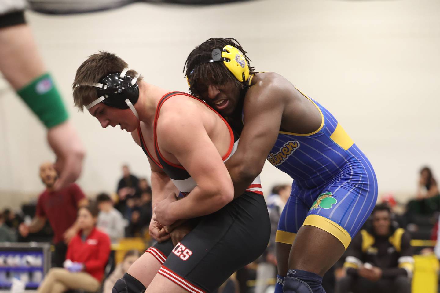 Charles Walker of Joliet Central wraps up Luke Chrisse of Yorkville in the 215-pound weight SPC Conference championship match at Joliet West on Saturday, Jan 25, 2025.