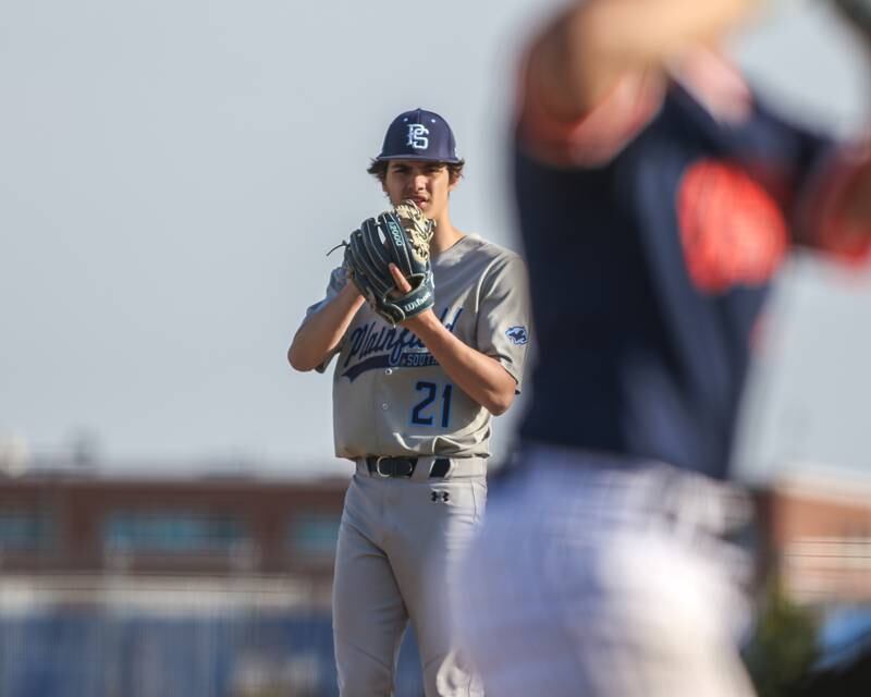 Plainfield South's Nicholas Ruenzi (21) looks in before delivering a pitch during baseball game between Plainfield South at Oswego on Monday, April 14, 2025 in Oswego.