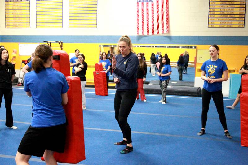Lyons Township High School teacher Katie Meyers leads a self defense class for girls at the school’s North Campus in La Grange.