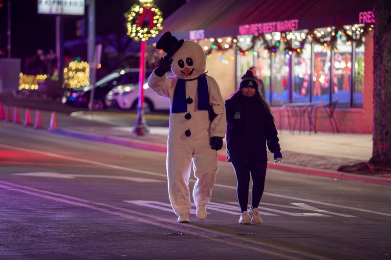 Frosty the Snowman waves to paradegoers during the annual Holly Days Frosty & Friends Parade in Westmont on Saturday, December. 7, 2024.