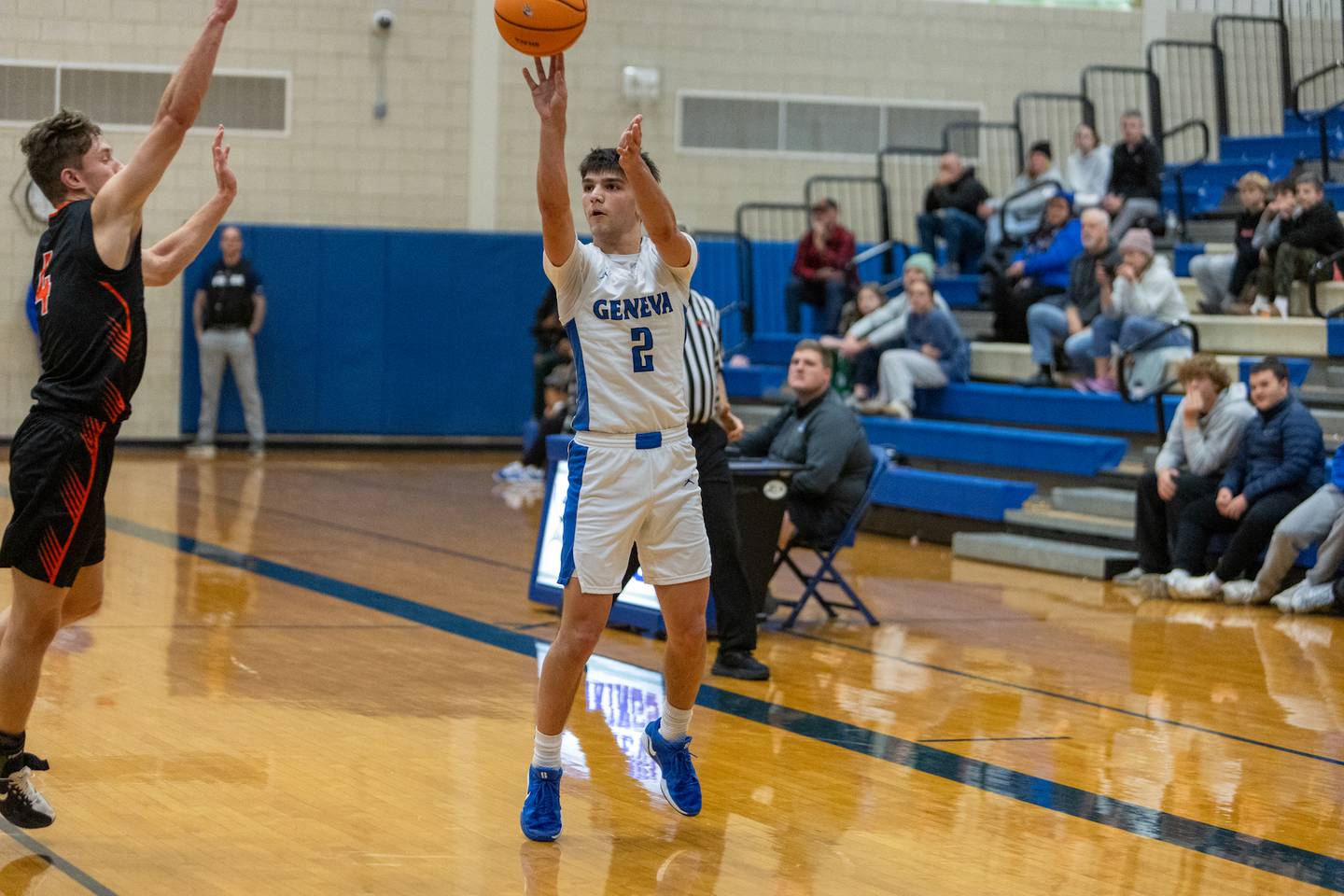 Geneva's Gabe Jensen shoots a three pointer against Wheaton Warrenville South on Wednesday, Dec.10,2025 in Geneva.