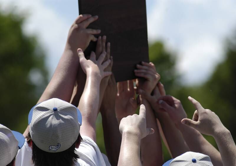 Neman players show fans the 2A Regional Championship plaque at the 2A Regional baseball game at Larry Ybarra field at Newman High School, Saturday, May 18th 2024.