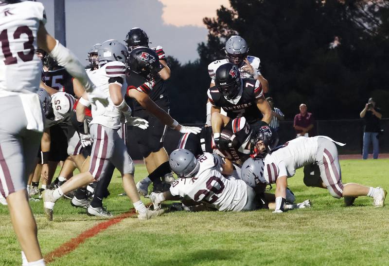 EP Panthers #22 Tristan Hovey charges over Rockridge's #20 Wyatt Osborn to get into the end zone and put the Panthers on the scoreboard during Friday nights conference match up in Erie.