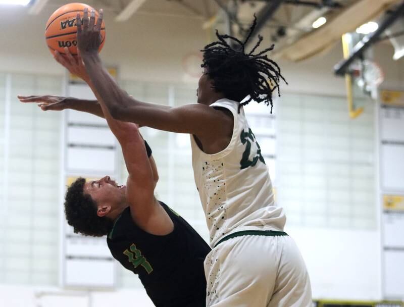 Crystal Lake South’s AJ Demirov, left, battles Grayslake Central’s Chris Jaimes under the hoop during Hinkle Holiday Classic varsity boys basketball tournament action on Thursday, Dec. 26, 2024 at Jacobs High School in Algonquin.