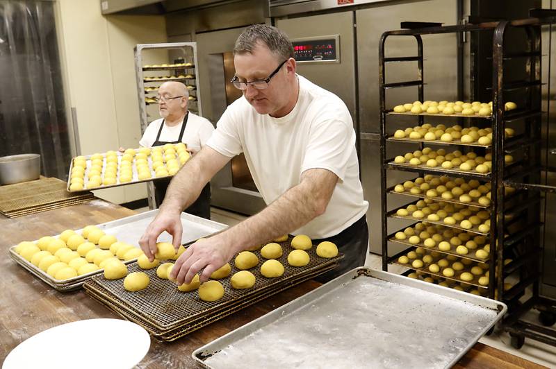 Bakers Drwal Mariusz (right) and Walter Trzyna make paczki Wednesday, Feb, 15, 2023, at Deli 4 You, at 1501 S. Randall Road in Algonquin. Area bakeries are prepping for the lead-up to Lent when paczki are traditionally eaten. Deli 4 You will make and sell around 30,000 paczki this week.