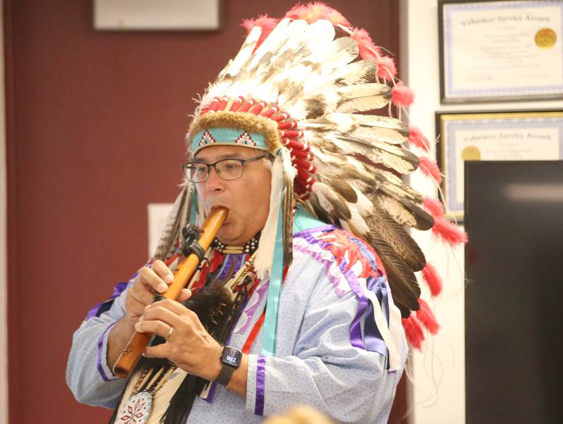 Gerald Savage, a tribal elder with the Ho-Chunk Nation, plays his flute during a program on Monday, Aug. 4, at the Richard A. Mautino Memorial Library in Spring Valley. Chief Savage spoke to about 40 people about the history of the Ho-Chunk Tribe, Native American instruments, stories and more. Chief Savage is an Illinois Humanities Road Scholar who speaks across the State and Wisconsin.
