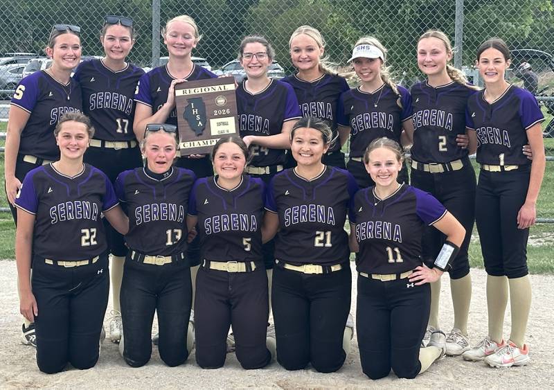 Members of the Serena softball team pose with the Class 1A Regional plaque after defeating Marquette 2-1 on Friday, May 22, 2026 at Serena High School.