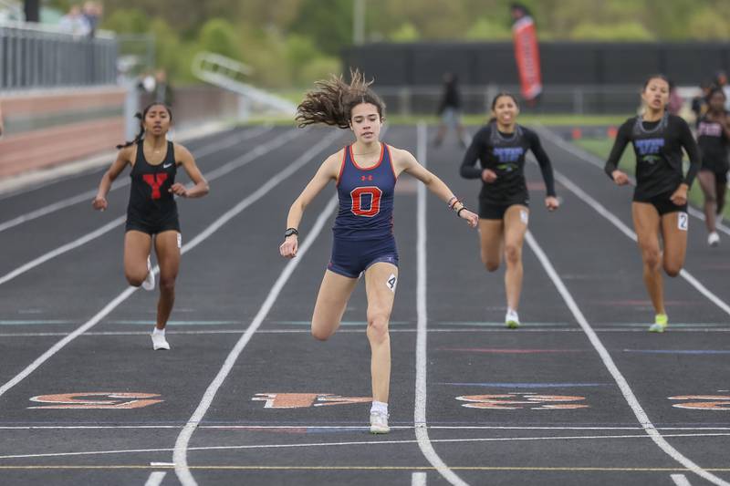 Oswego's Araceli Desimoni wins her heat in the 400 during Southwest Prairie Conference Girls Track and Field Meet Wednesday, May 7, 2025 in Minooka.