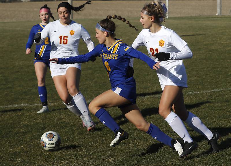 Johnsburg’s Elizabeth Smith controls the ball between Richmond-Burton’s Brianna Maldonado (left) and Blake Frericks during a Kishwaukee River Conference soccer game on Wednesday, March 20, 2024, at Johnsburg High School.