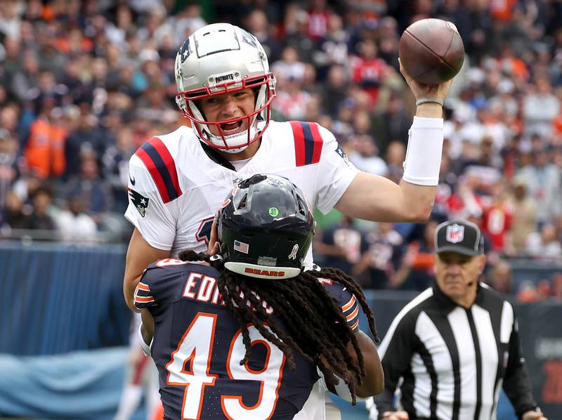 Chicago Bears linebacker Tremaine Edmunds hits New England Patriots quarterback Drake Maye as he throws during their game Sunday, Nov. 10, 2024, at Soldier Field in Chicago.