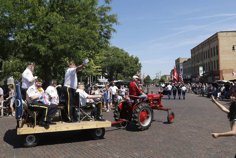 Members of the Woodstock VFW Post 5040  Honor Guard ride around the Woodstock Squarer during the Woodstock VFW Post 5040 City Square Memorial Day Ceremony and Parade on Monday, May 29, 2023, in Woodstock.