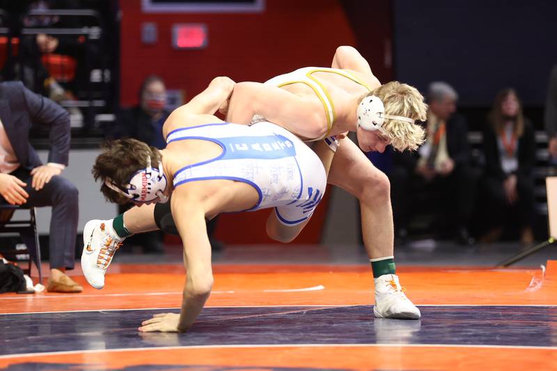 Lockport’s Brayden Thompson drops Marmion’s Tyler Perry in the Class 3A 170lb. championship match at State Farm Center in Champaign. Saturday, Feb. 19, 2022, in Champaign.