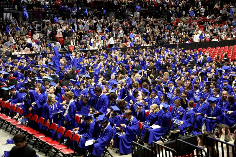 St. Charles North graduates throw their caps into the air following the school’s 2025 commencement ceremony on Thursday, May 22, 2025 at Northern Illinois University in DeKalb.