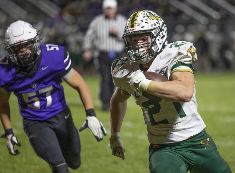 Coal City’s Logan Natyshok runs it in for a 2-pt conversion against Dixon Friday, Nov. 7, 2025.