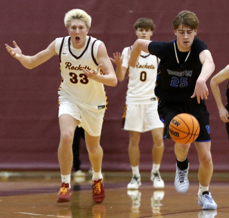 Woodstock's Liam Laidig pushes the ball up the court after Richmond-Burton's Luke Robinson lost the ball  during a Kishwaukee River Conference boys basketball game on Friay Jan. 9  2026, at Richmond-Burton High School, in Richmond.