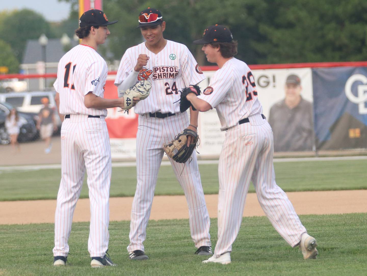 Pistol Shrimp players Joey Cecola, Kedren Kinzie and Brendan Comerford wish each other good luck before playing the last home game of the season on Wednesday, Aug. 2, 2023 at Schweickert Stadium in Peru.