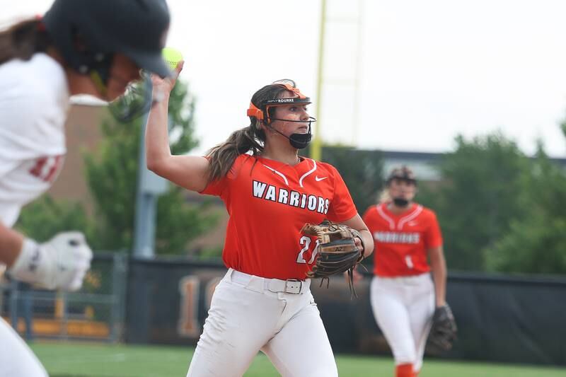 Lincoln-Way West’s Reese Rourke throws to first for the out against Lincoln-Way Central on Tuesday, May 14, 2024 in New Lenox.
