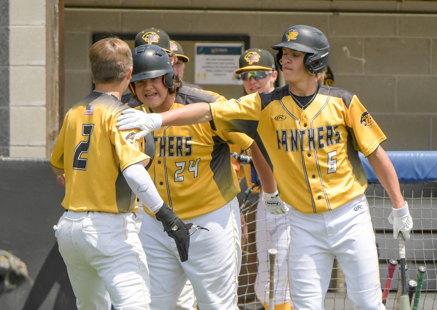 Andrew Pyszka (2) is congratulated by his Putnam County teammates after scoring a run against Marquette during the Class 1A Harvest Christian Sectional at Judson College in Elgin on Saturday, May 28, 2022.