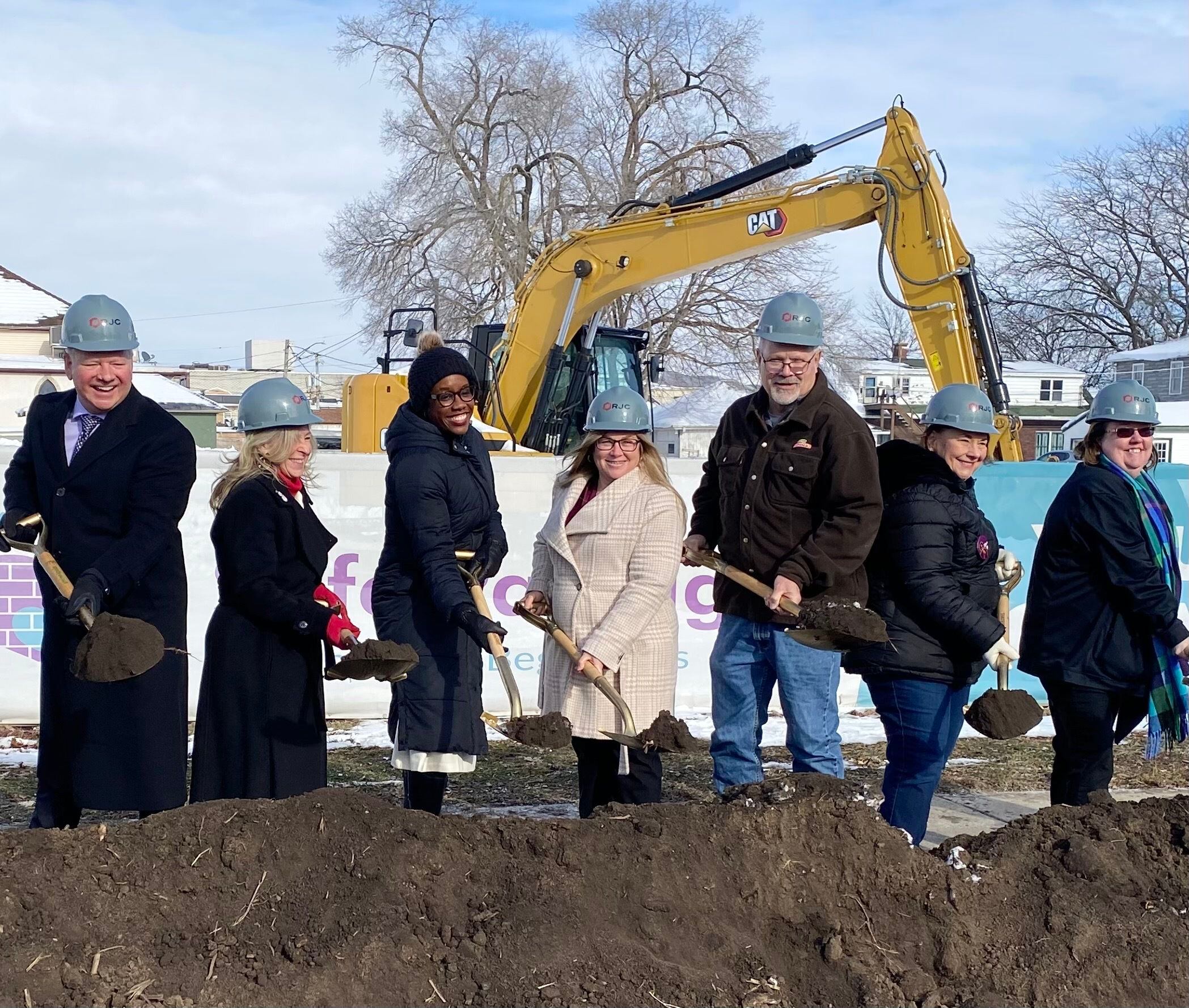 Officials including Ringland-Johnson Construction CEO Brent Johnson (from left); Christine Kaline of Safe Passage Inc.; U.S. Rep. Lauren Underwood, D-Naperville; and Rebecca Versluys, executive director of Safe Passage, break ground Friday, Dec. 5, 2025, on construction of the crisis shelter's new building at 217 S. Franklin St., in DeKalb.