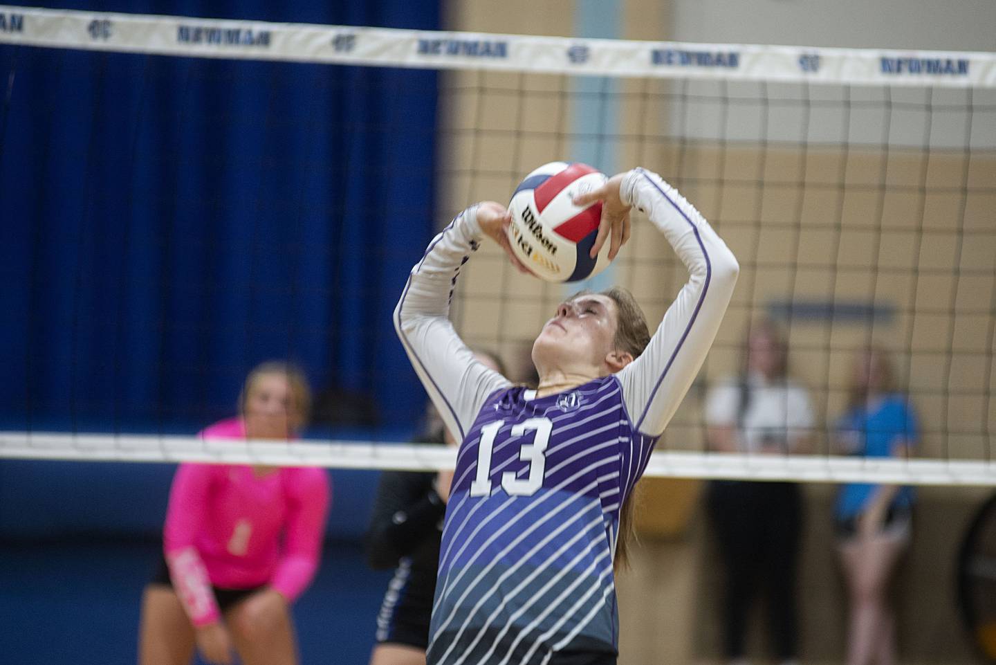 Dixon’s Hanna Lengquist sets a shot against Newman Monday, Aug. 29, 2022.