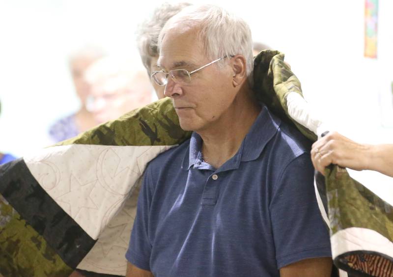 U.S. Army Veteran Michael Brown, of Spring Valley, receives his Quilt of Valor during the Tribute to Veterans on Wednesday, Aug. 20, 2025 at the Bureau County Fair in Princeton.