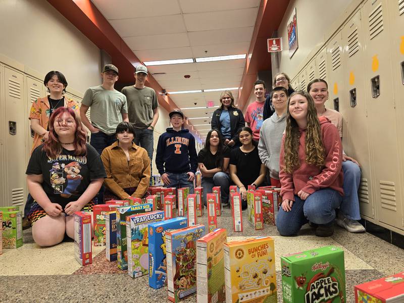 Setting up the Streator FFA cereal box dominoes on Tuesday, March 18, 2025, were (back, standing) Destany Krebsbach, Eddie Devera, Aiden Haag, Jenna Moritz, Klay Schaffner, Hannah Spellious (front sitting) Aeriannah Moral, Diana Duran, John Lukach, Elysa Labra, Talisa Horton, Tanner Gammie, Addie Mahan and Kaitlyn Pettyjohn.