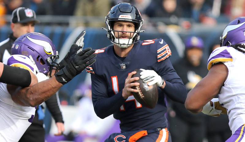 Chicago Bears quarterback Nathan Peterman is pressured by the Minnesota pass rush Sunday, Jan. 8, 2023, during their game at Soldier Field in Chicago.