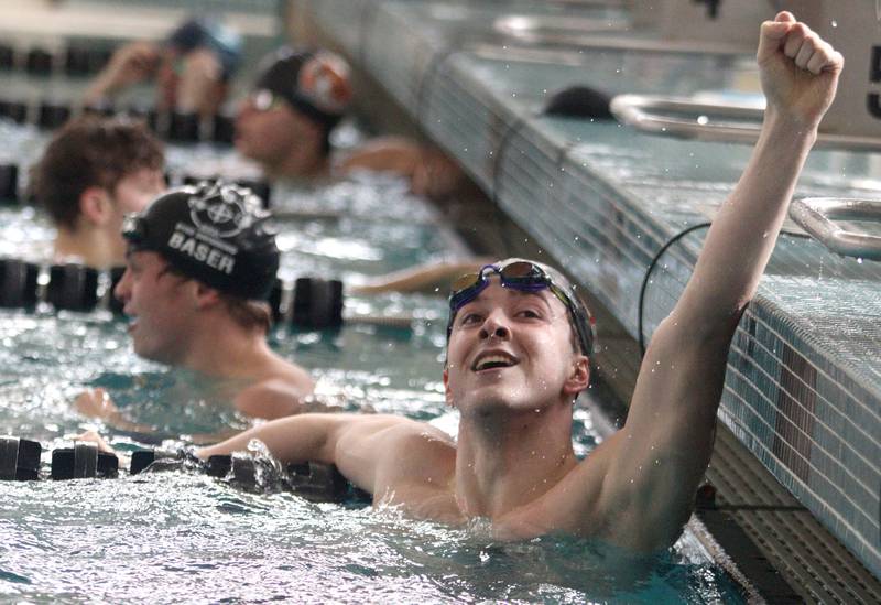 Luke Hackemack of Huntley celebrates after completing  the 200-Yard Freestyle during the Fox Valley Conference Swimming Championships at Woodstock North High School Saturday.