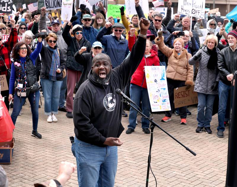 Rev. Joe Mitchell, lead pastor at New Hope Missionary Baptist Church in DeKalb, speaks passionately to the hundreds of people assembled Saturday, April 5, 2025, for a Hands Off! rally at Memorial Park on the corner of First Street and Lincoln Highway in DeKalb. The group gathered to protest against various policies of President Donald Trump and his administration.