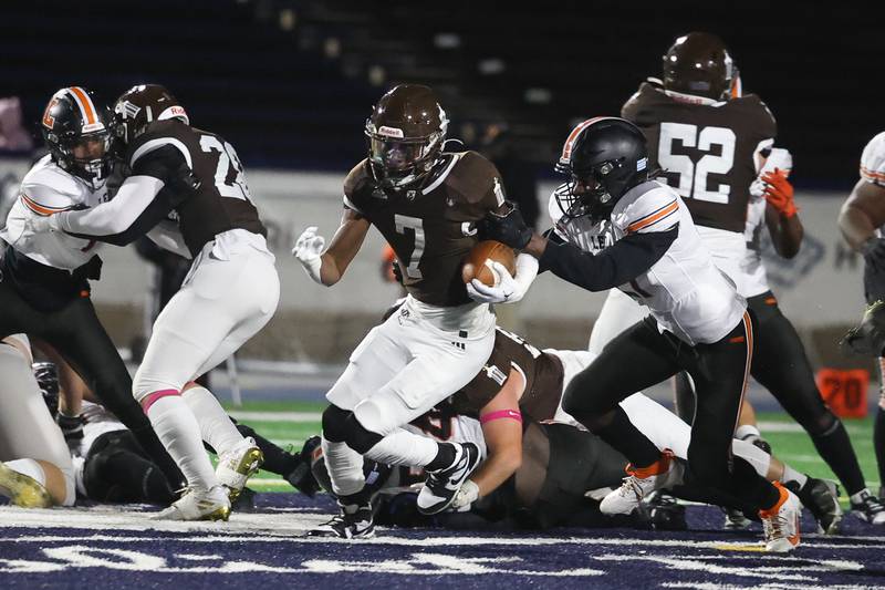 Joliet Catholic’s HJ Grigsby breaks through up the middle against Leo on Friday, Oct. 6, 2023 in Joliet.