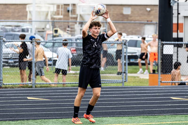 Minooka's Jamie Franson throws in during a varsity soccer home game against Romeoville on Sept. 23, 2025.