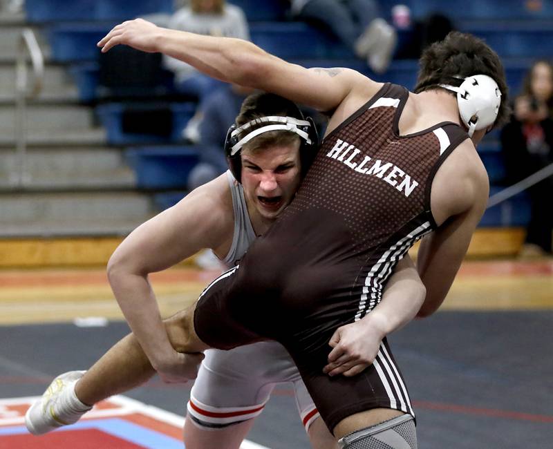 Marian Central's Jimmy Mastny tries to take down Joliet Catholic's Issac Clauson in their 190-pound match during a triangle wrestling meet on Saturday Jan. 11, 2025, between Marian Central, Joliet Catholic, and Mt. Carmel at Marian Central High School in Woodstock.