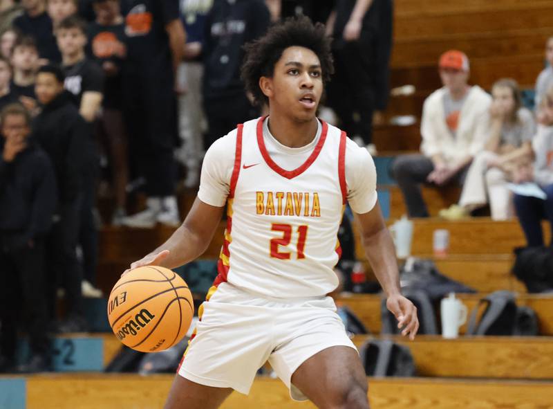 Batavia's Xavier Justice (21) brings the ball down the court during the IHSA boys class 4A Willowbrook regional final between Wheaton Warrenville South and Batavia on Friday, Feb. 27, 2026 in Villa Park, IL.
