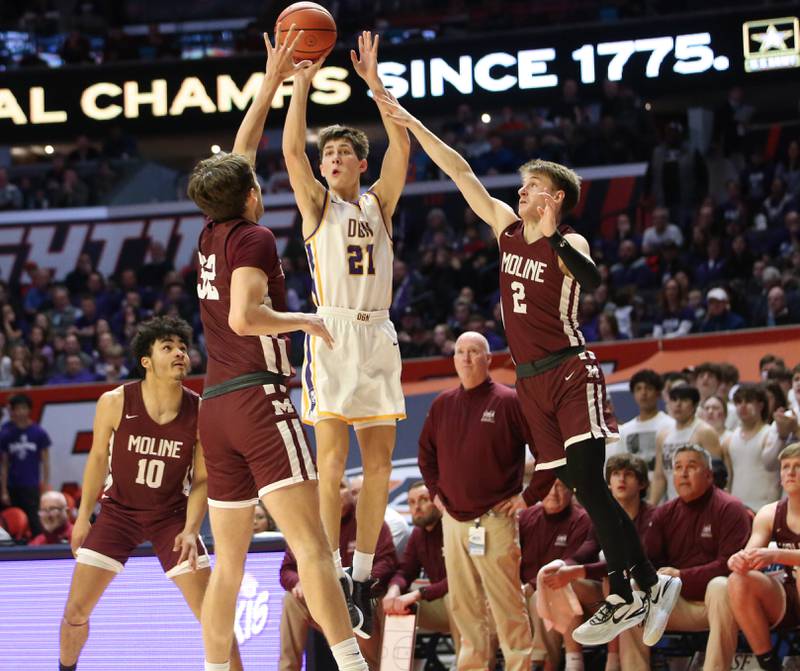 Downers Grove North's Jack Stanton shoots a three-point shot over Moline's Owen Freeman and Brock Harding during the Class 4A state semifinal game on Friday, March 10, 2023 in Champaign.