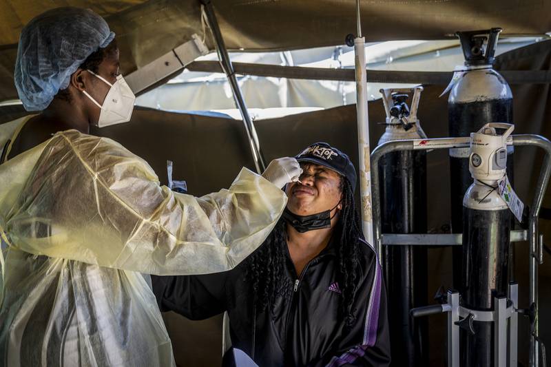 A woman is tested for COVID-19 at the Lenasia South Hospital, near Johannesburg, South Africa