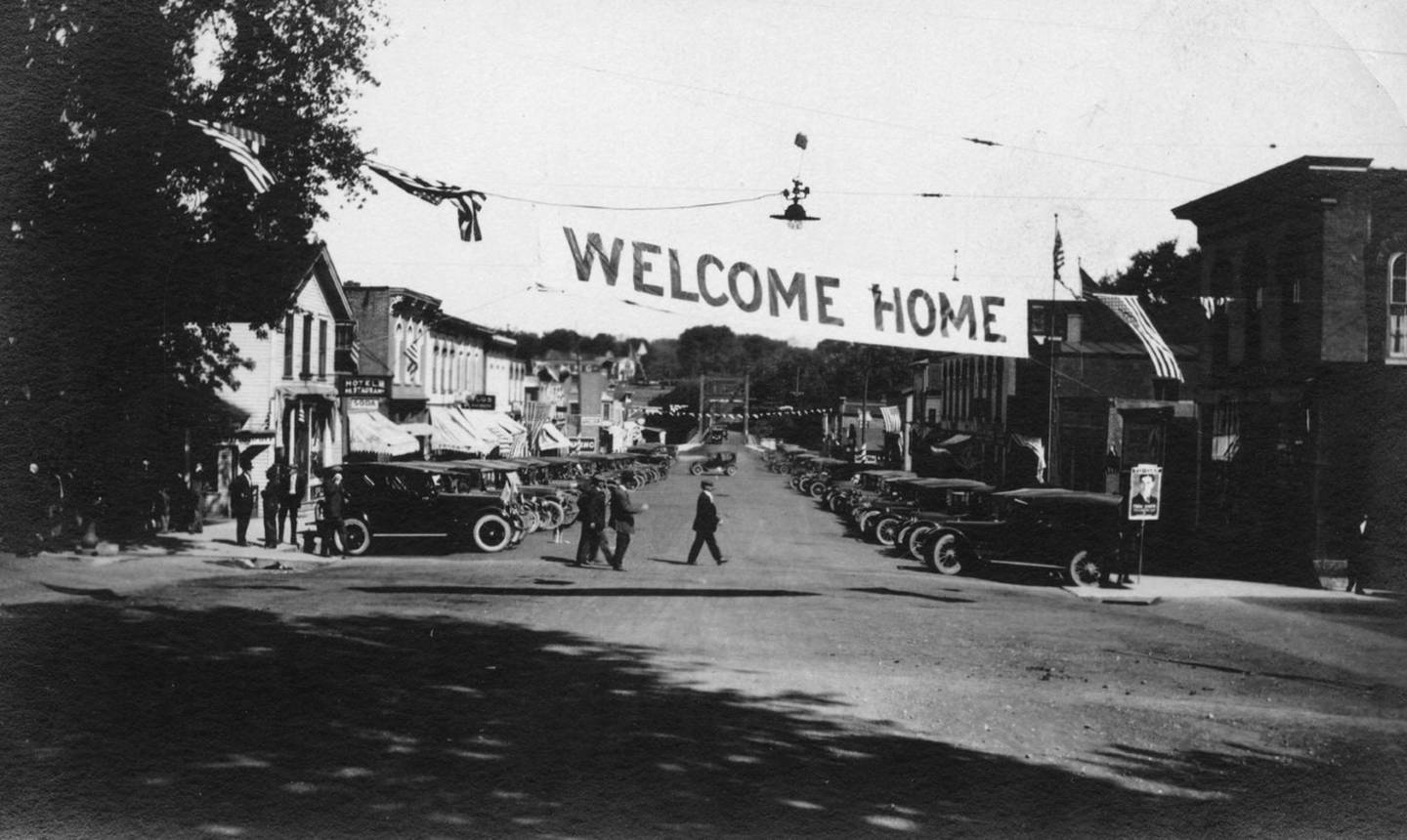 A "Welcome Home" banner hung across Bridge Street (Route 47) in downtown Yorkville on Sept. 25, 1919 as Kendall County welcome home its World War I veterans. (Photo provided by the Little White School Museum)