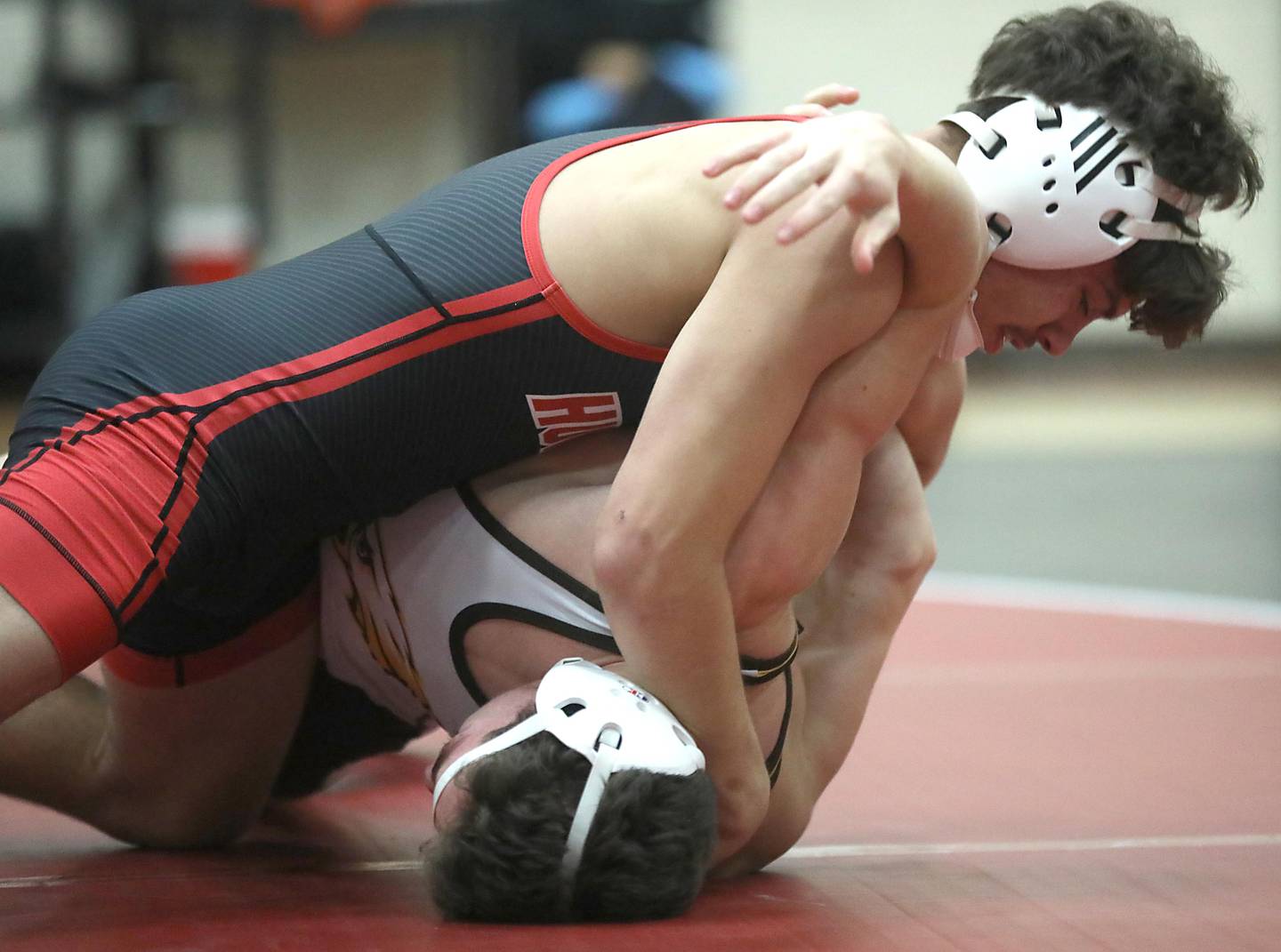 Huntley’s Gavin Nischke tries to pin Jacobs’ Asher Bonilla during the 150—pound match of a Fox Valley Conference wrestling meet on Thursday, Dec. 11, 2025, at Huntley High School.