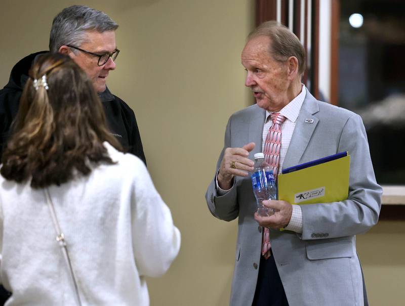 Second Ward Alderman candidate Michael Embrey (right) talks to attendees Wednesday, Feb. 19, 2025, at the DeKalb Area Rental Association and DeKalb Area Builders Association Candidate Night at Faranda's Banquet Center in DeKalb.