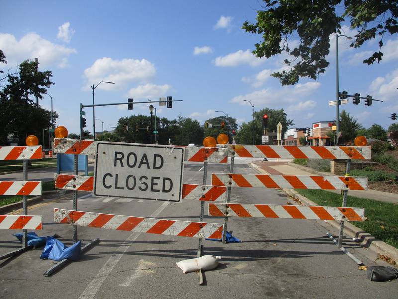 Road barriers block northbound Raynor Road at the Six Corners intersection in Joliet on Saturday. Aug. 9, 2025
