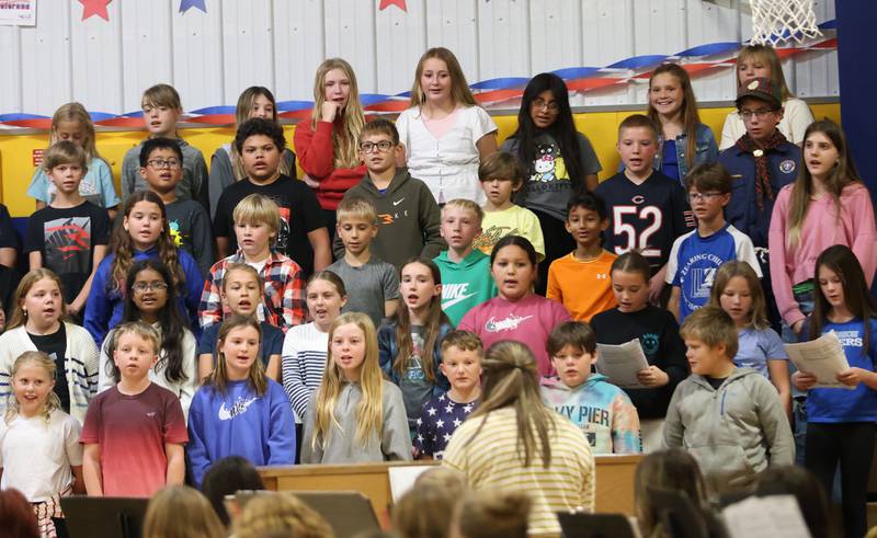 The Logan Jr. High 5th grade choir sings songs during the Veterans Day program on Friday, Nov. 7, 2025 at Logan Jr. High in Princeton .