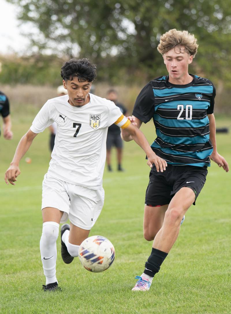 Harvard's Jesus Aquino, left, and Woodstock North's Ethan Richardson chase down the ball during the Kishwaukee River Conference Tournament Championship game on Monday, October 6, 2025 at Woodstock North High School. Ryan Rayburn for Shaw Local