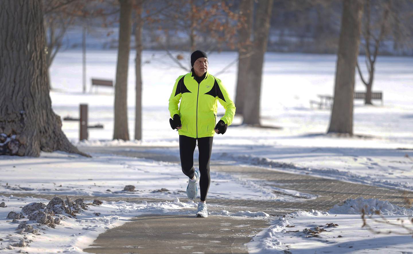 Glen Ellyn resident Lincoln Bode trains at Lake Ellyn Park in Glen Ellyn. Bode, a retired 63-year-old with vast prior experience, mainly "adventure running," will compete in the World Marathon Challenge's "777 Challenge" -- seven marathons on seven continents on seven straight days. Bode is running in memory of his father, Hank Bode, and to raise donations and awareness of Parkinson's disease, which afflicted his father for 9 years before his death Jan. 27, 2025.