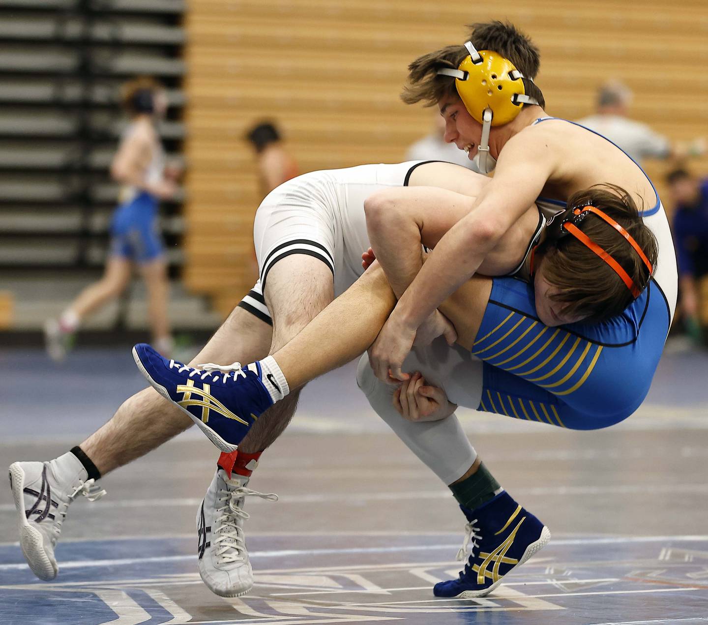 St. Charles East’s Dom Munaretto wrestles Wheaton North’s Rocco Maciellaio at 120-lbs at the 2025 DuKane Boys Varsity Tournament Saturday, Jan. 25, 2025 in St. Charles.