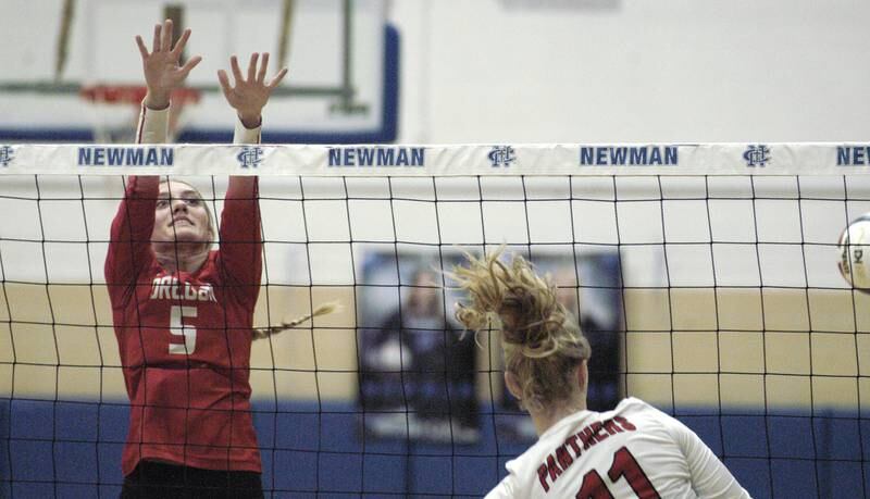 Oregon's Skylar Bishop blocks a ball frpm E-P's Lauren Abbott. Erie-Prophetstown took on Oregon in the Class 2A regional volleyball semifinal Tuesday, Oct. 29, 2024 at Newman High School.