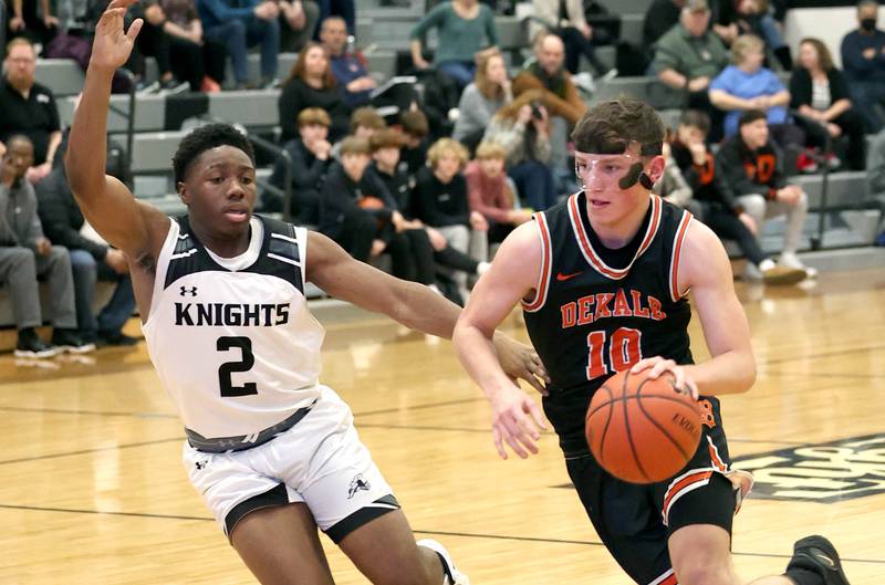 DeKalb's Eric Rosenow drives around Kaneland's Gevon Grant during their game Tuesday, Jan. 24, 2023, at Kaneland High School.