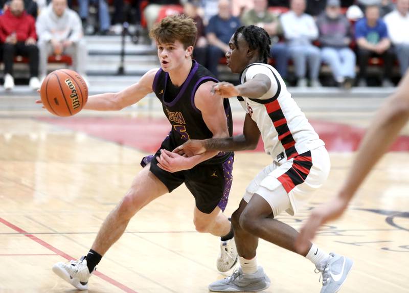 Downers Grove North’s Owen Thulin drives toward the basket during the Class 4A East Aurora Boys Basketball Sectional final against Bolingbrook on Friday, March 1, 2024.