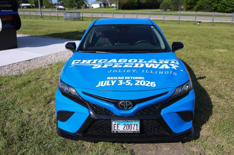 A NASCAR Toyota Next Gen car promotes the return of NASCAR to Joliet at the unveiling of the new Route 66 sculpture along South Chicago Street at the Route 66 Raceway on Tuesday, May 12, 2026 in Joliet.