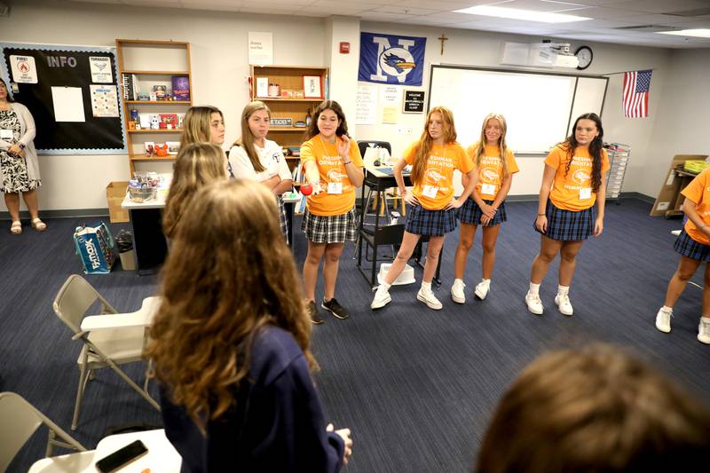 Nazareth Academy student leaders participate in an ice-breaker game with freshmen during freshman orientation at the La Grange Park school on Thursday, Aug. 17, 2023.