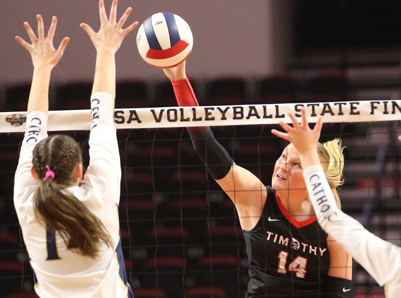 Timothy Christian's Audrey Williams spike is blocked by Bloomington Central Catholic's Rosie Krenz during the Class 2A State semifinal game on Friday, Nov. 15, 2024 at CEFCU Arena in Normal.